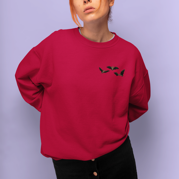 Red Sweatshirt with Bats embroidered onto Jumper.