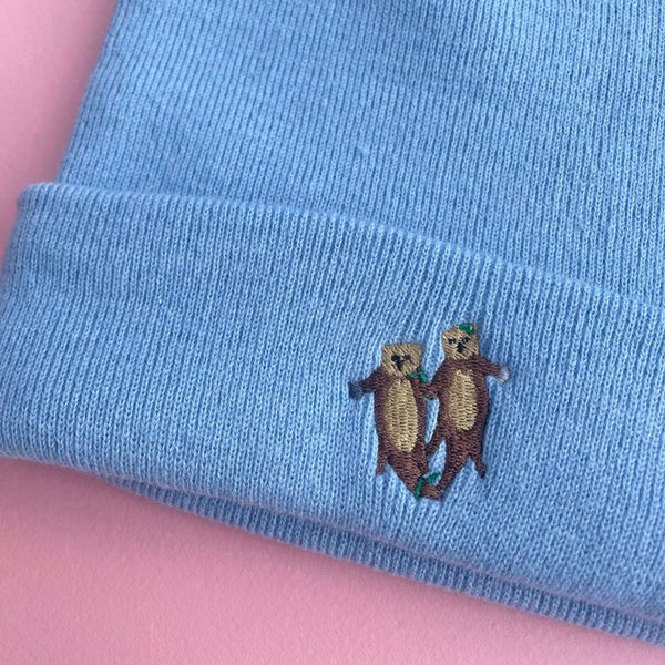 Otters holding hands Embroidered Beanie Hat