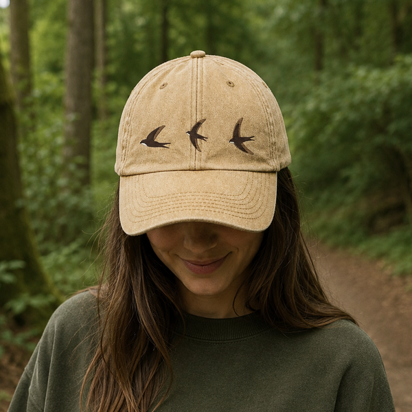 Vintage-style washed cotton cap with embroidered swift bird design